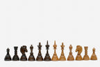 The sixteen-sided chess set shown folded and closed on its handle