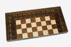Blossoms and stems carved around the wooden chessboard
