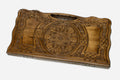Carved beechwood backgammon board with a grand carved ornament and interlace panels, propped open