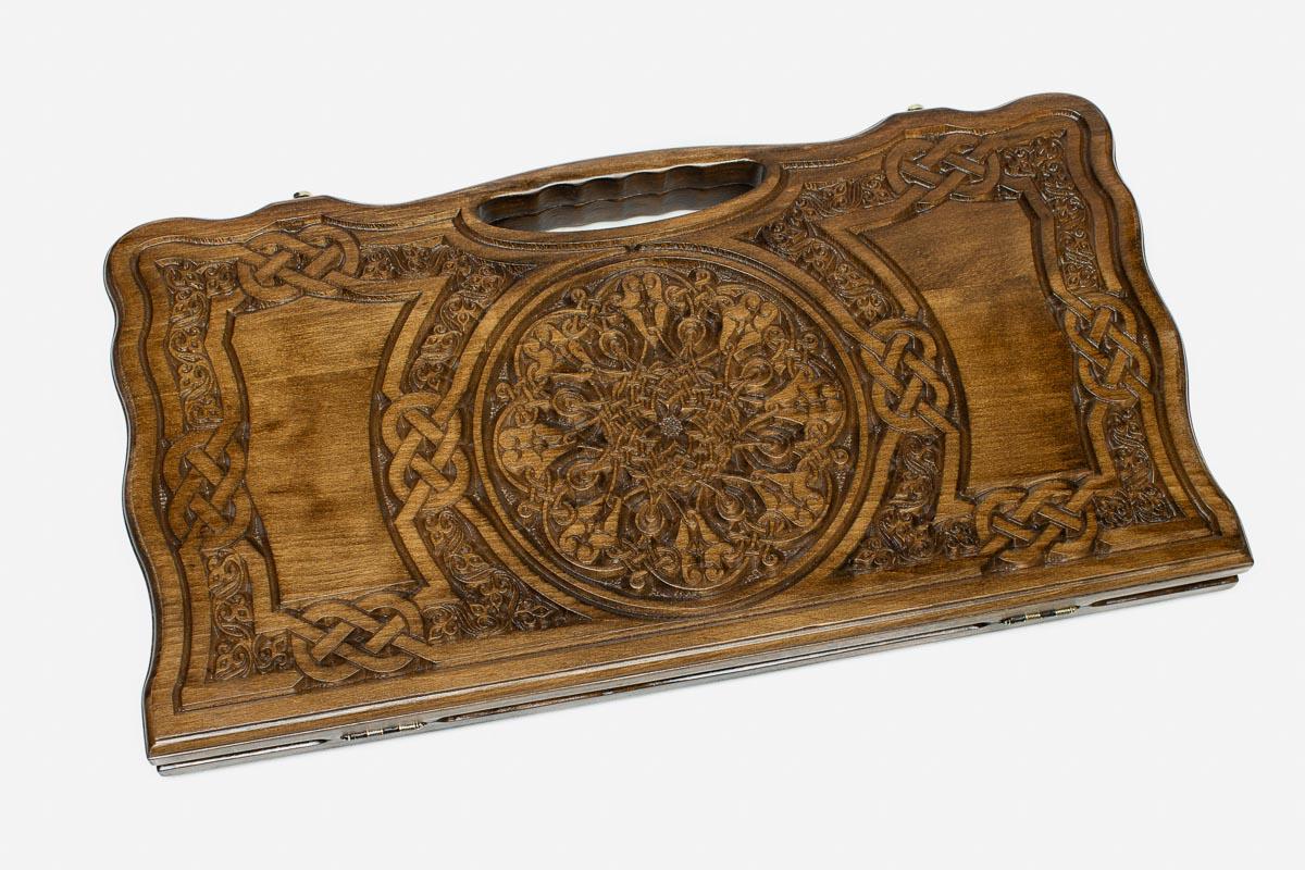 Angled view of the grand ornament carved backgammon board