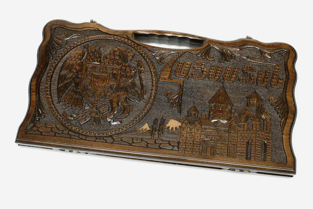 The backgammon board opened to show the wooden playing surface
