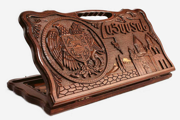 Carved beechwood backgammon board with the Armenian coat of arms and Russian landmarks, propped open