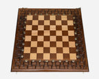 Hand-cut lattice covering the wooden chess board frame