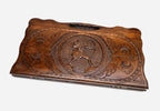 The backgammon board opened to show the wooden playing surface