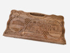The backgammon board opened to show the wooden playing surface