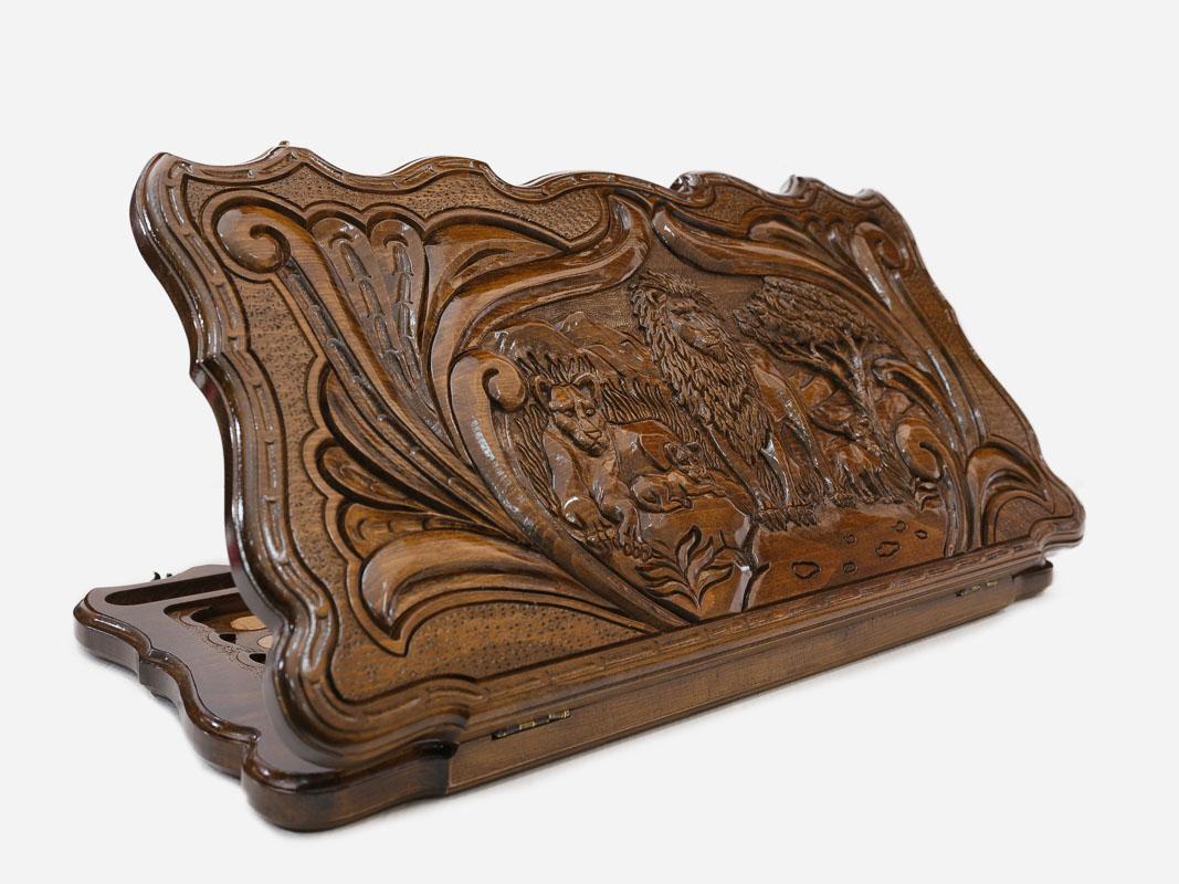 Hand-carved lion pride on wooden backgammon set