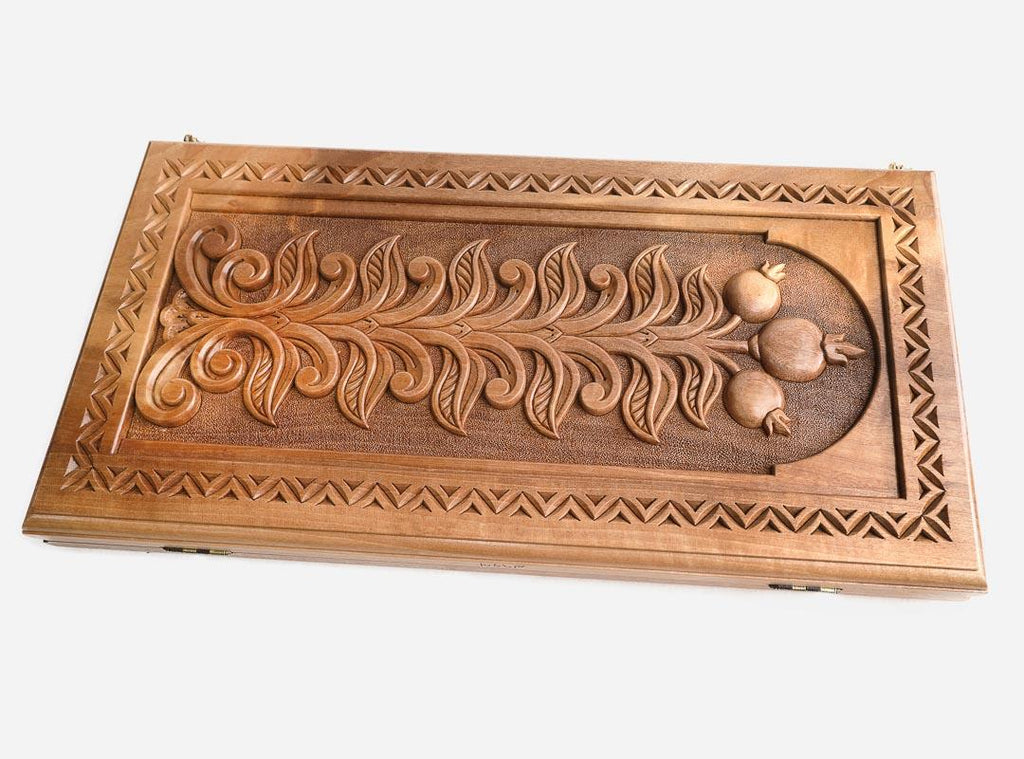 The backgammon board opened to show the wooden playing surface