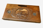 The backgammon board opened to show the wooden playing surface