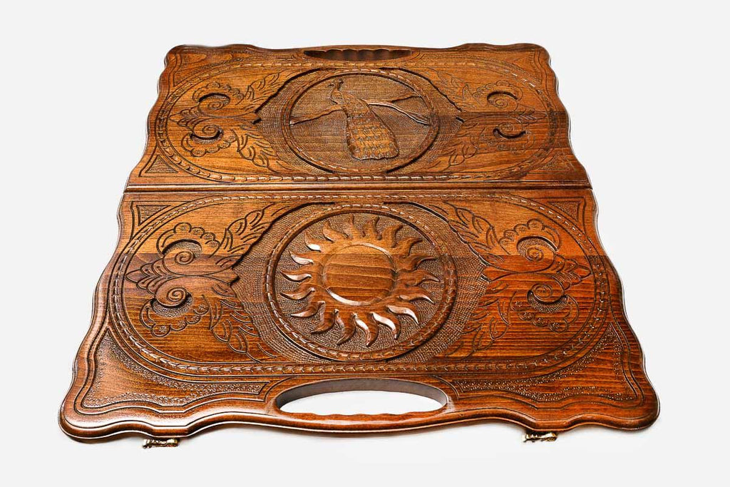 Detail of the floral scrollwork around the carved center