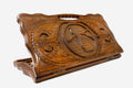 Carved beechwood backgammon board with a peacock and radiant sun and a carry handle, propped open