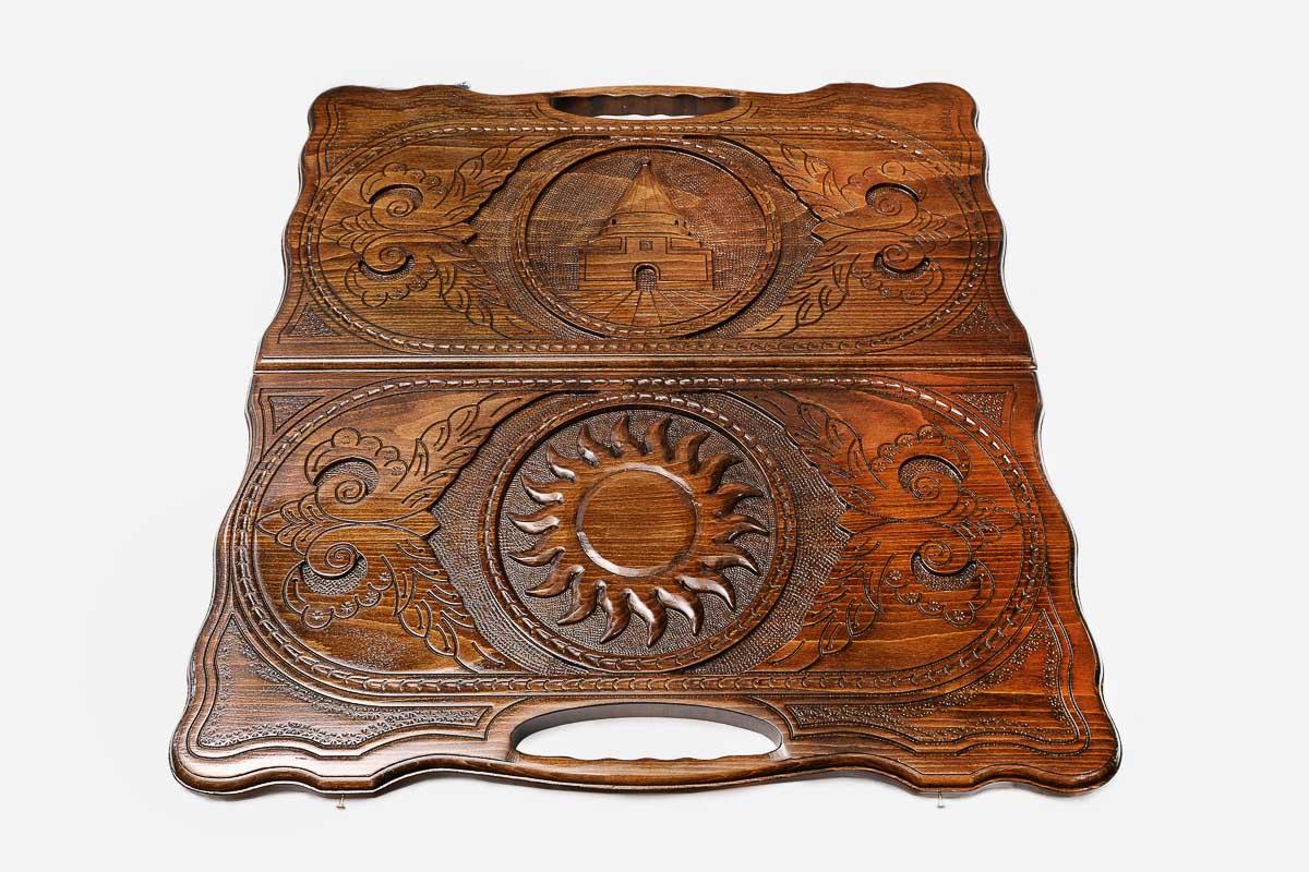 Side view of the folded board with its carry handle