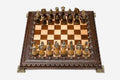 Luxury chess set with figural bronze pieces on a carved board
