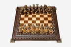 Luxury chess set with figural bronze pieces on a carved board