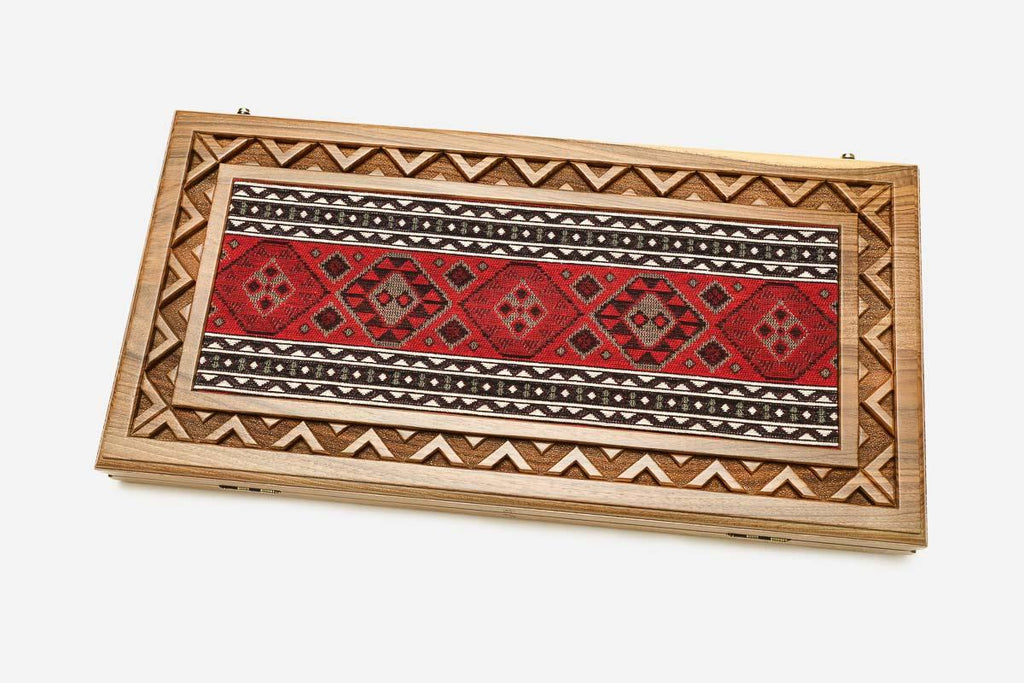 The backgammon board opened to show the wooden playing surface