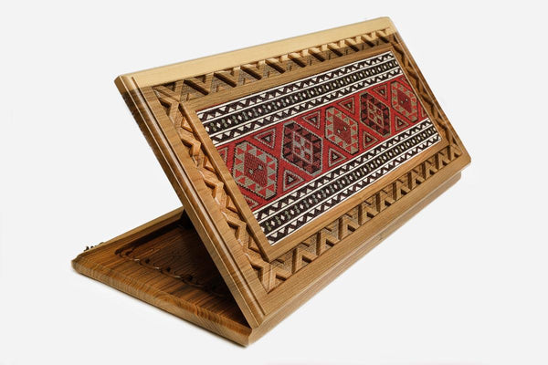 Walnut backgammon board with an Armenian national costume ornament panel and a carry handle, propped open