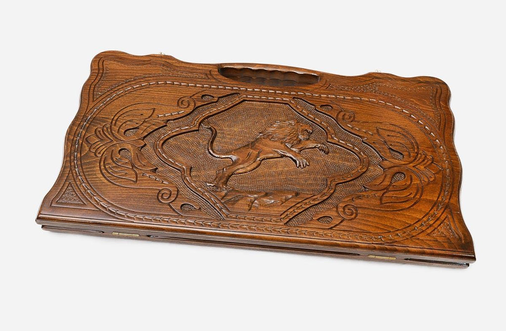 The backgammon board opened to show the wooden playing surface