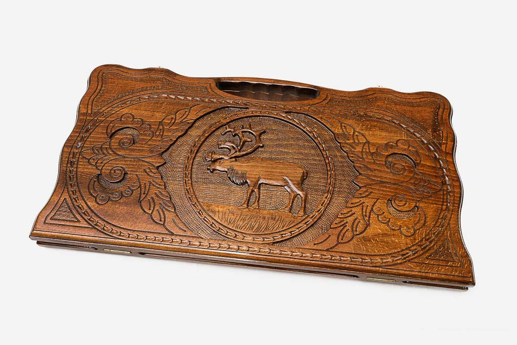 The backgammon board opened to show the wooden playing surface