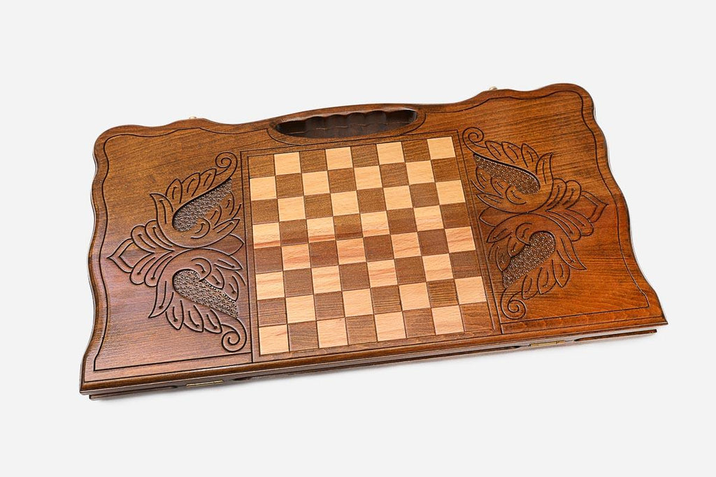 Angled view of the lion head carved backgammon board