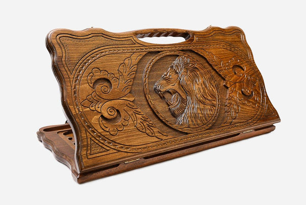 Carved beechwood backgammon board with a lion's head and a carry handle, propped open