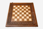 Twisted-rope carving framing the wooden chessboard