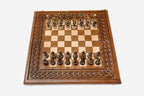 Figural bronze chess pieces on the rope-border board