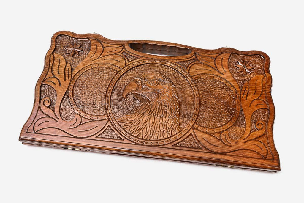 The backgammon board opened to show the wooden playing surface