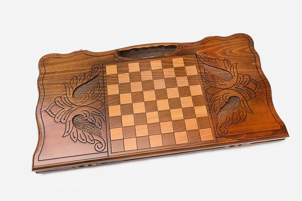 Angled view of the eagle and star carved backgammon board