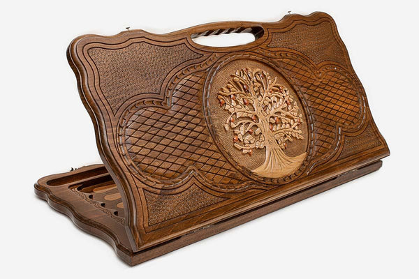 Carved beechwood backgammon board with a Tree of Life bearing red fruit, propped open
