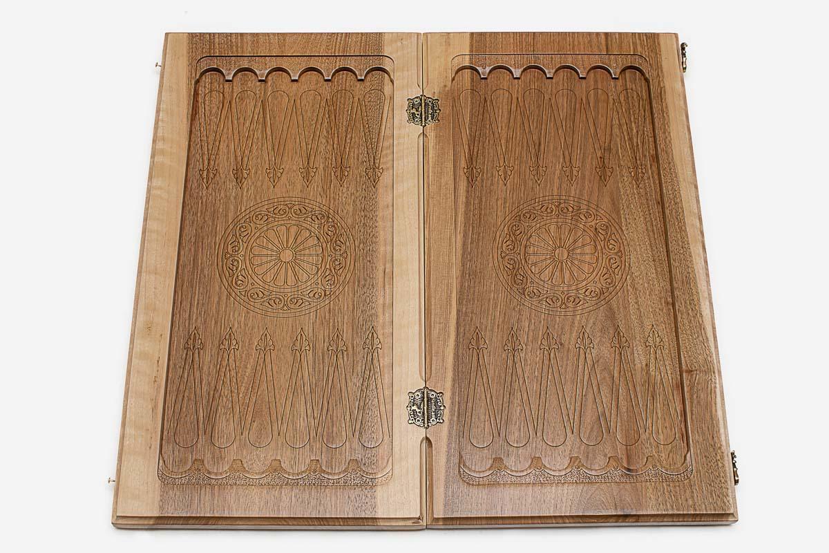 The carved basket-weave lattice and floral scrollwork across the closed board
