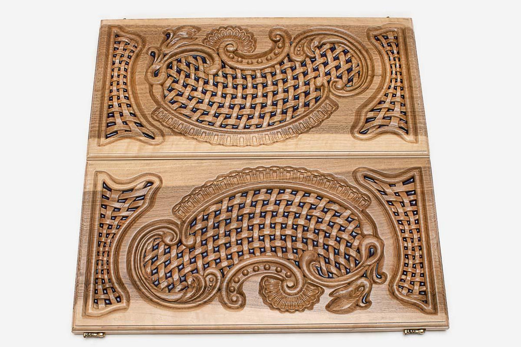 Close-up of the openwork carving with blue epoxy showing through