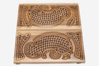 Close-up of the openwork carving with blue epoxy showing through
