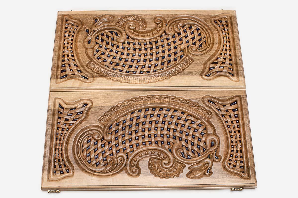 Close-up of the openwork carving with blue epoxy showing through