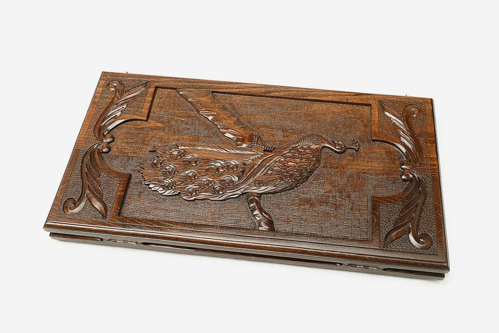 Carved reverse face of the peacock backgammon set