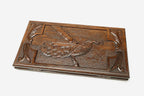 Carved reverse face of the peacock backgammon set