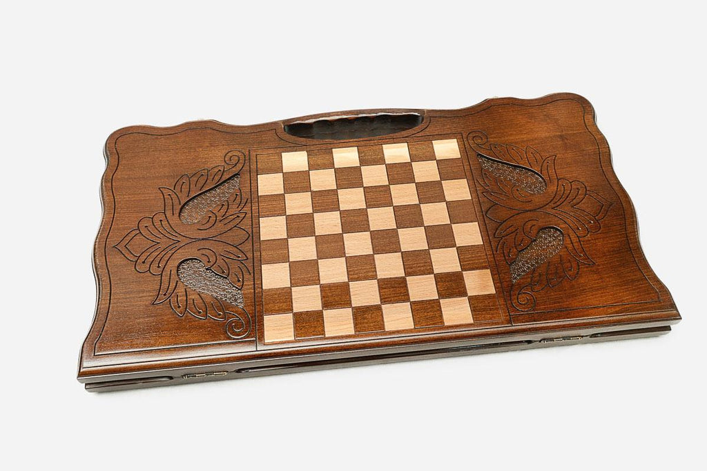 Angled view of the wolf medallion carved backgammon board