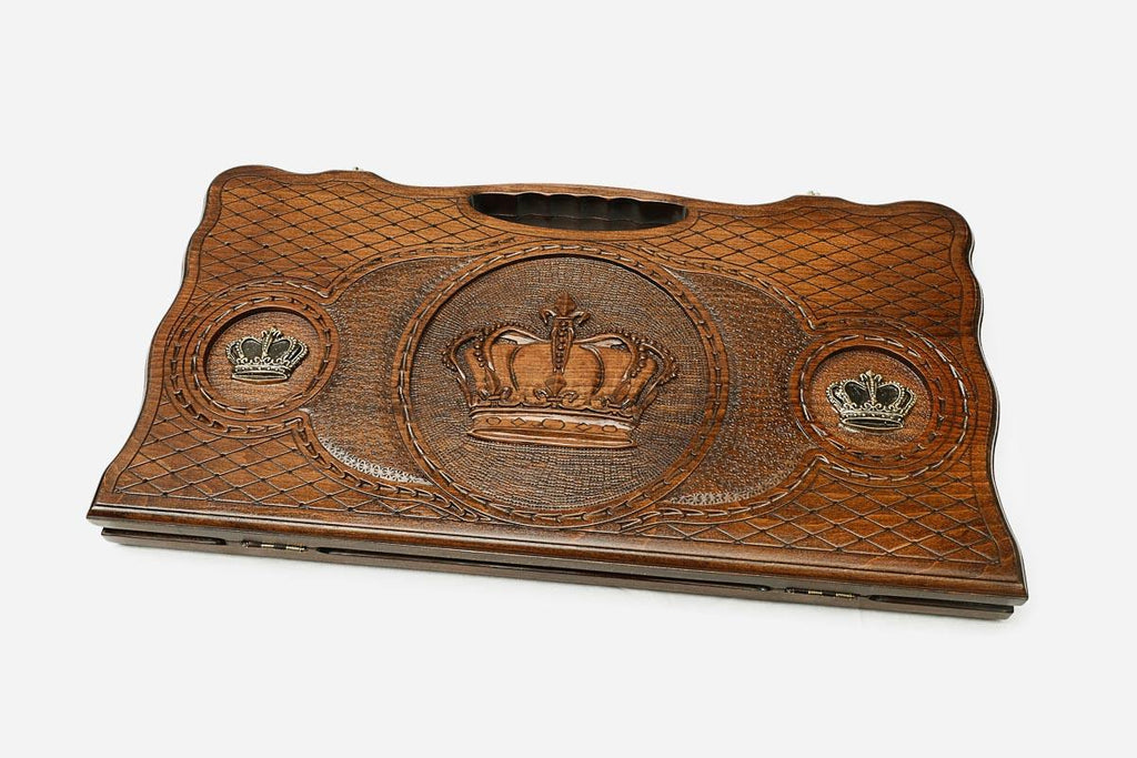 The backgammon board opened to show the wooden playing surface