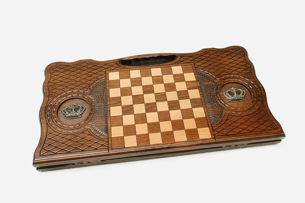 Angled view of the bronze crown carved backgammon board