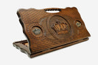 Carved beechwood backgammon board with a crown and bronze details, propped open