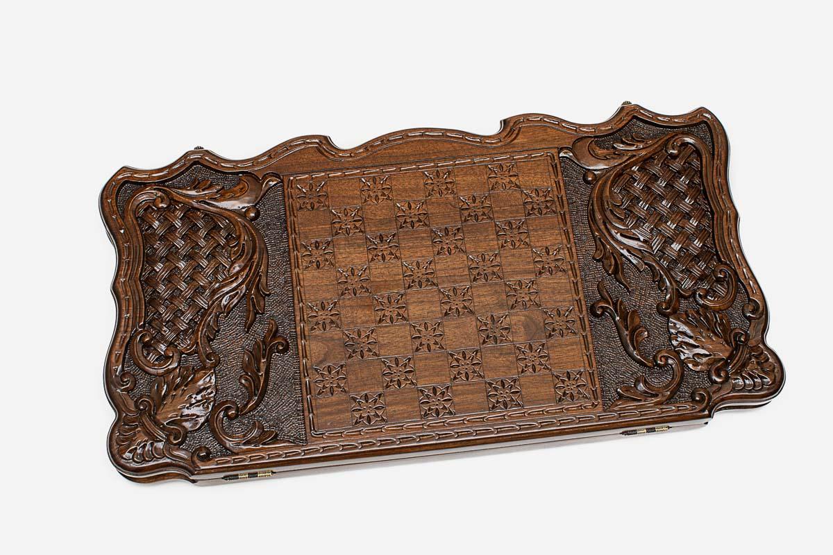 Angled view of the Dance of Sasun carved backgammon board