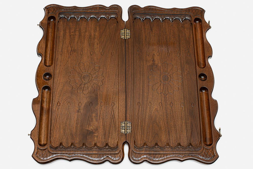 The backgammon board opened to show the wooden playing surface