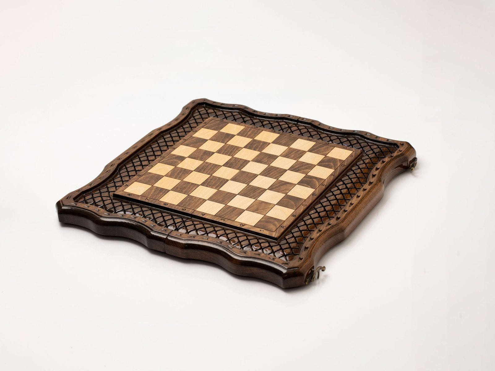 Hand-carved chess pieces in light and dark wood
