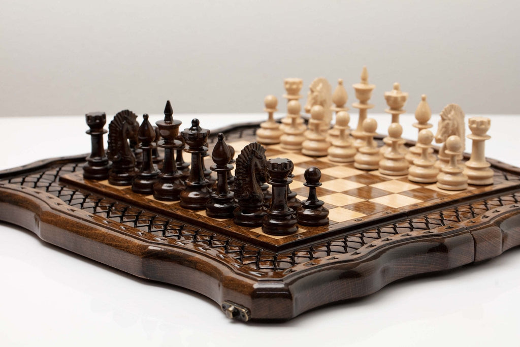 Handmade wooden chess set displayed open