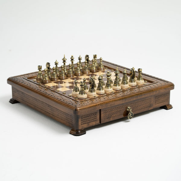Handmade wooden chess set with integrated storage, open to show premium bronze chess pieces.