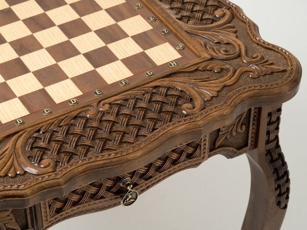 Carved border detail of the bronze-piece chess table