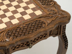 Carved border detail of the bronze-piece chess table