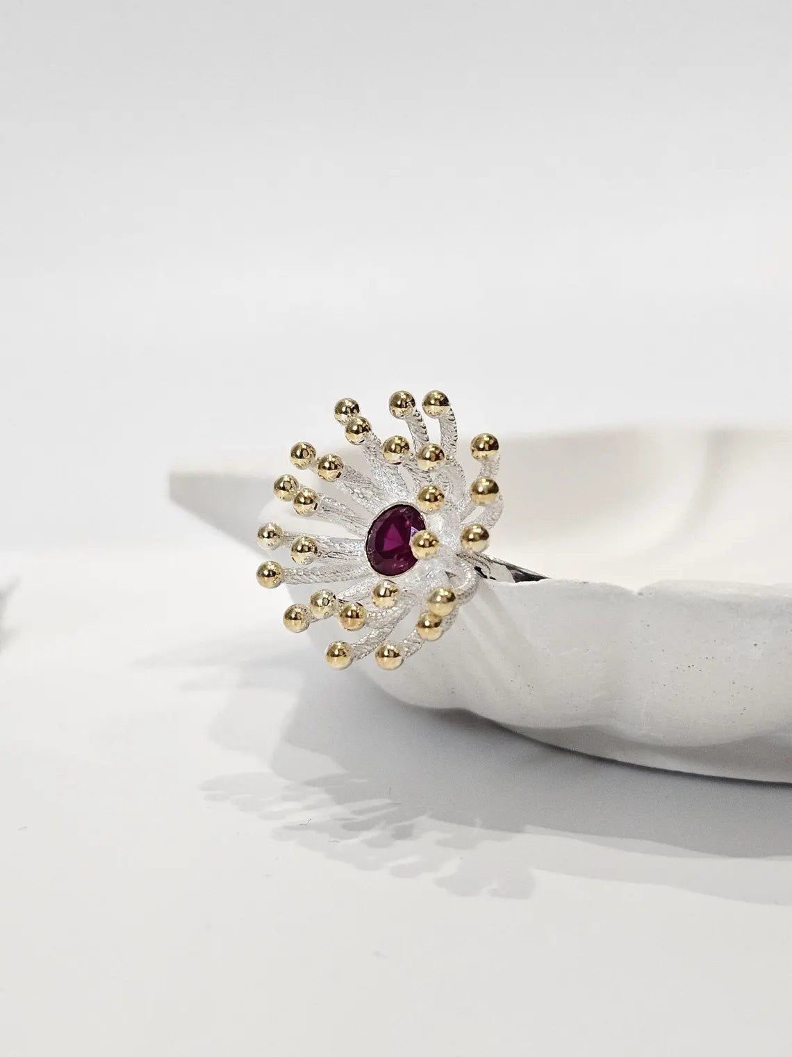 Gold-plated Dandelion ring with rich red rhodolite gemstone