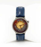 Artistic silver watch with blue leather strap and gold sun dial