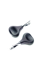Two black hair clips with a textured design on a white background