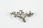 Handmade sterling silver bird branch brooch