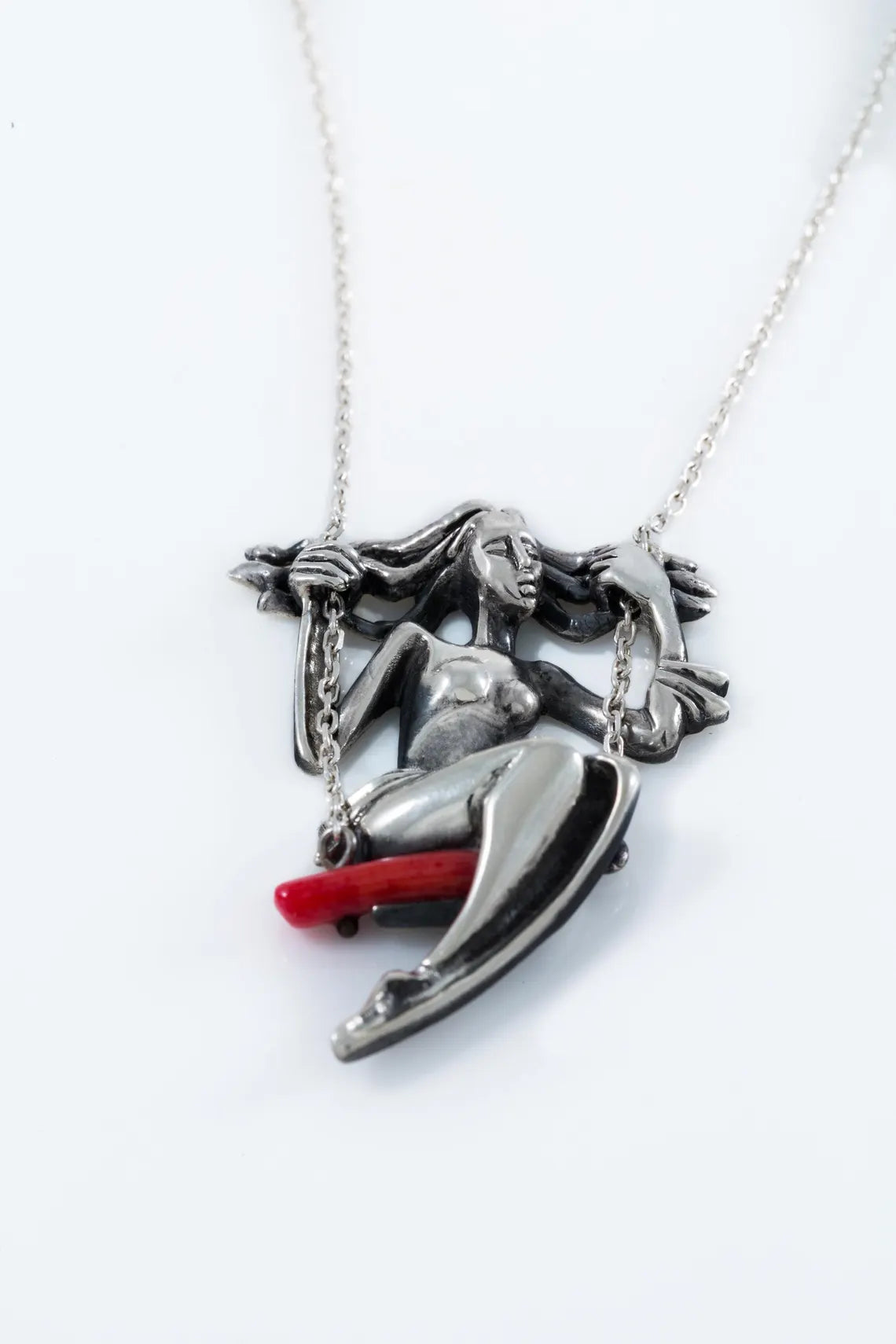 Artistic silver necklace with natural red coral